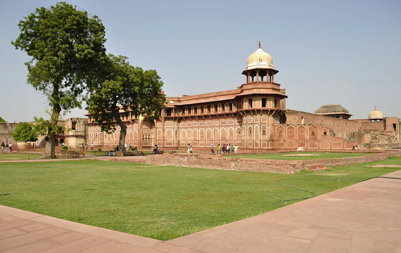 Agra Fort - Historic red sandstone fort of medieval India also known as the Red Fort Agra at sunrise. Agra Fort is a UNESCO World Heritage site in the city of Agra India.